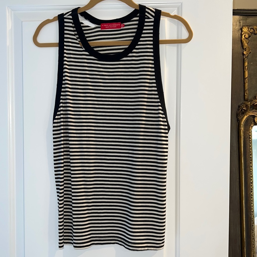 N: philanthropy black & white striped tank with tear detail